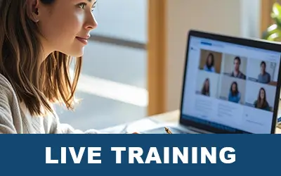Woman with brown hair attending a live training session on a laptop, taking notes.